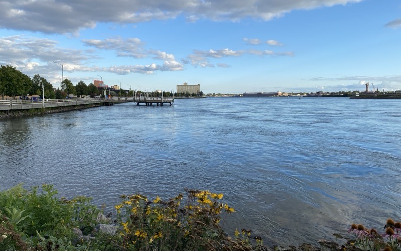 The St. Marys River waterfront in Sault Ste. Marie on a sunny day